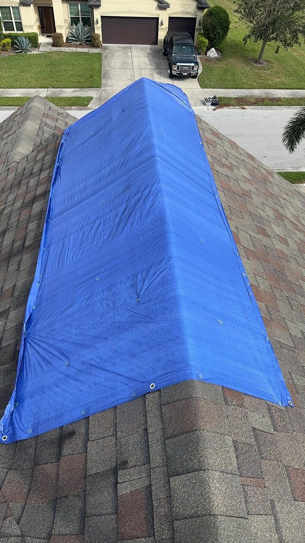 Emergency roof tarp installed by AR Legacy Roofing after storm damage