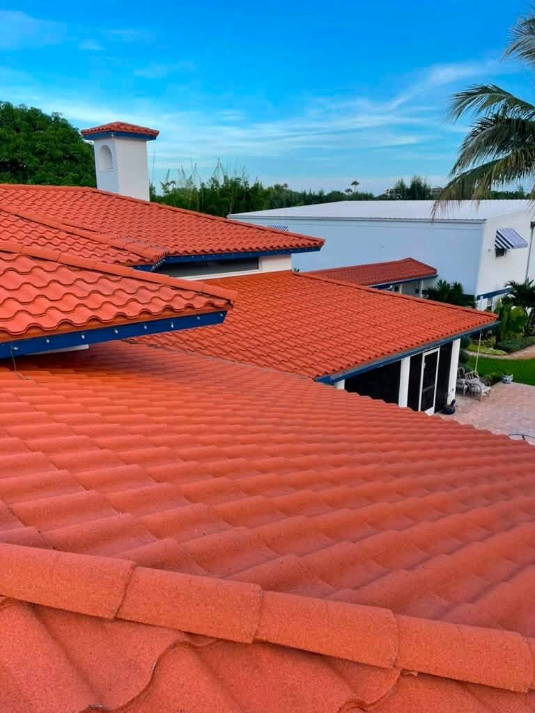 Terracotta tile roof detail with chimney cap