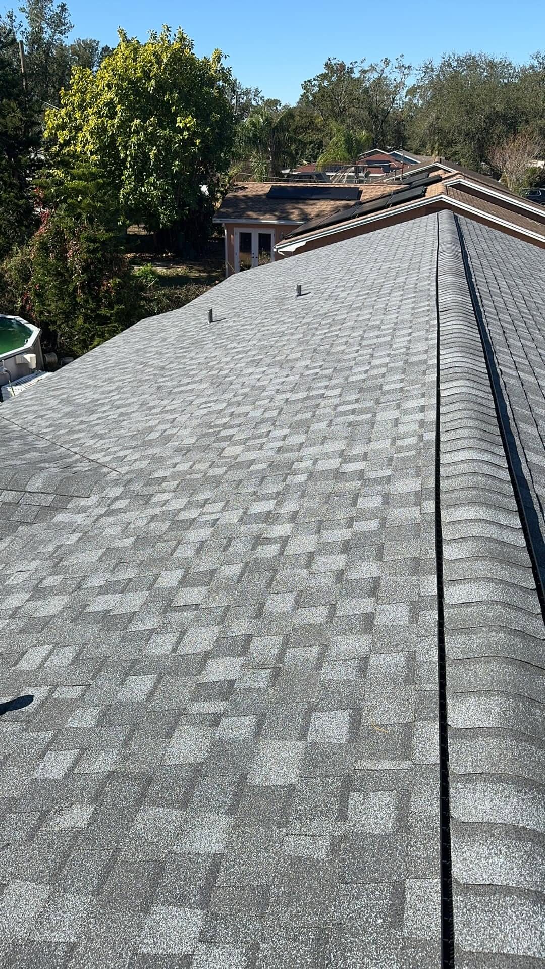 Close-up of finished dimensional shingle roofline