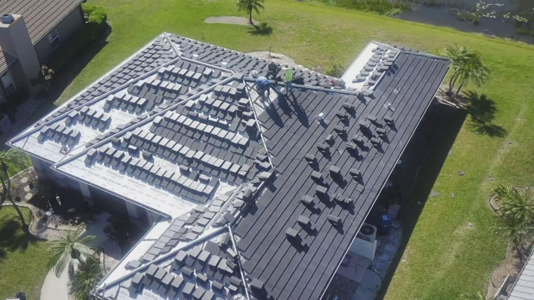 Aerial view of a tile roof installation in progress by AR Legacy Roofing