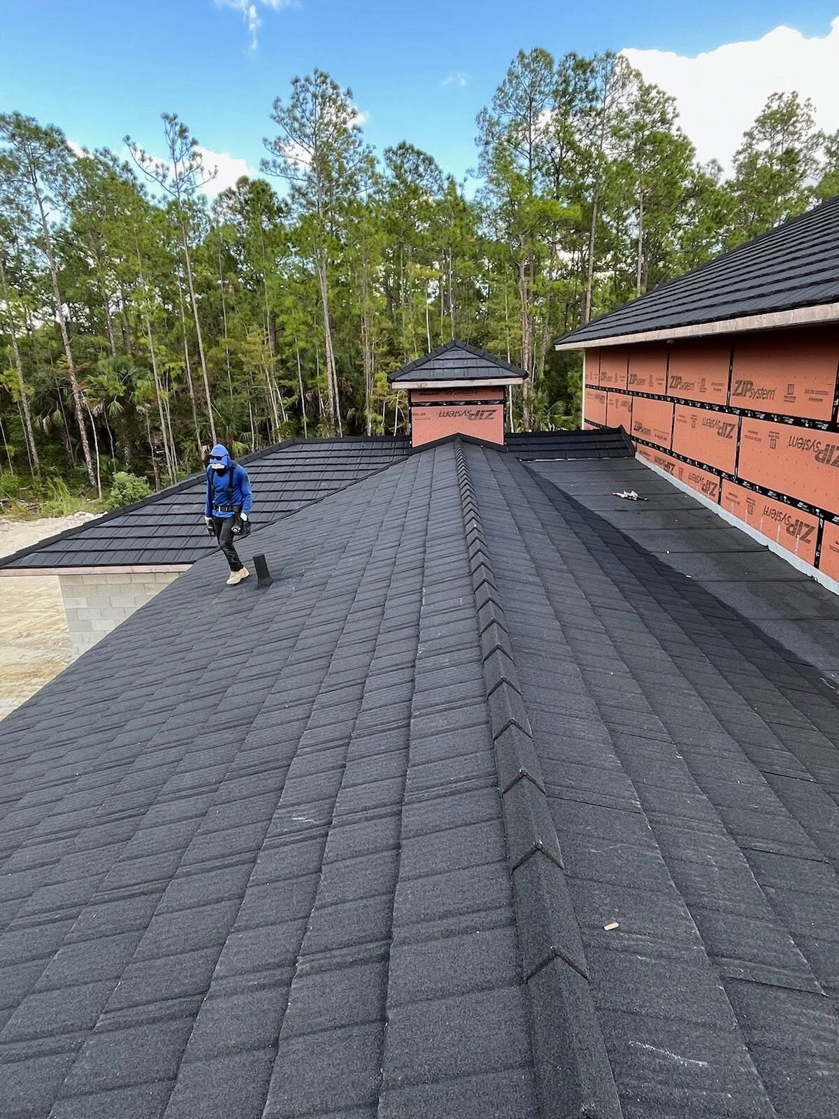 Stone-coated metal roof panel installation