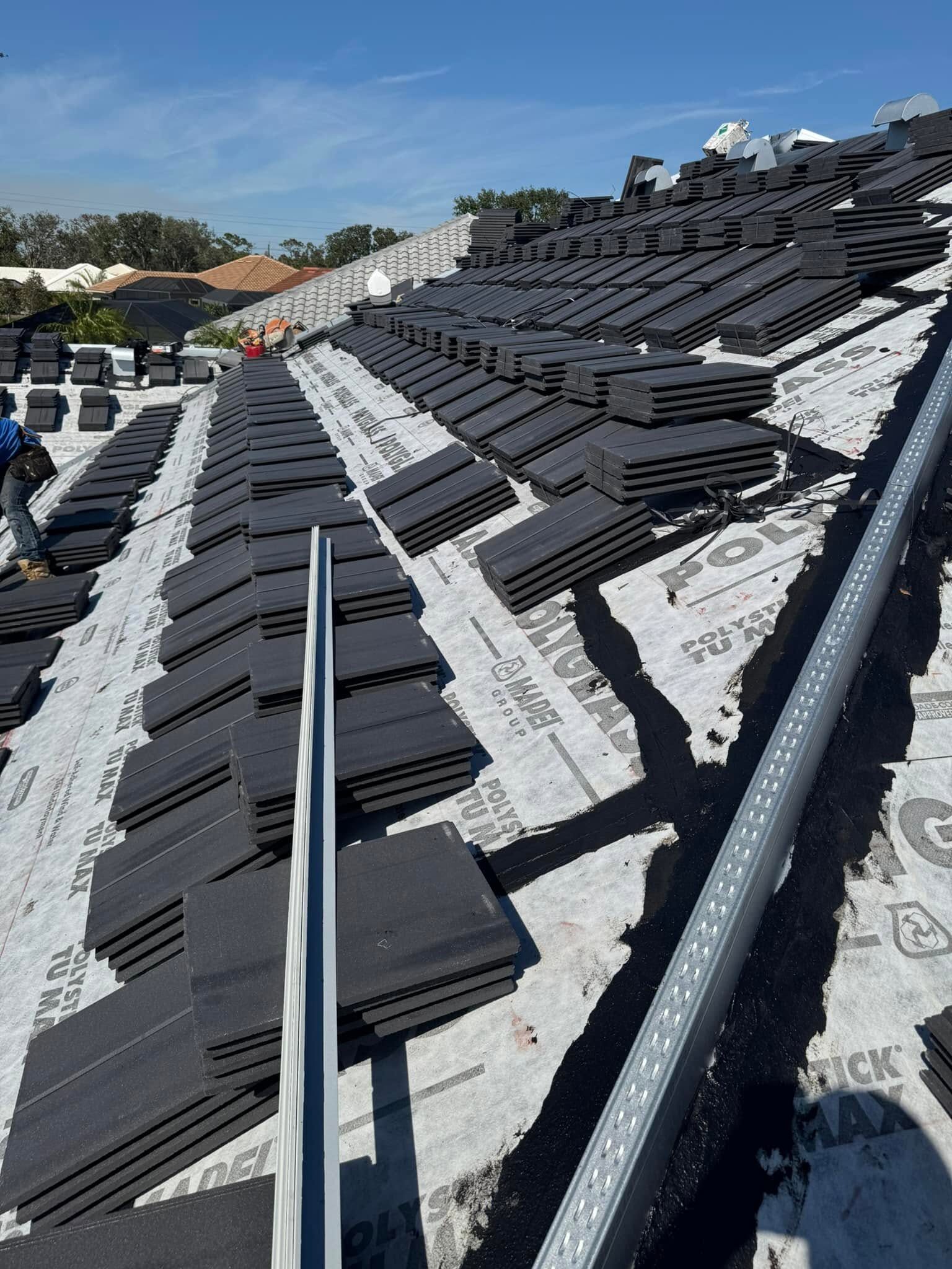 Tile roof material staging on underlayment